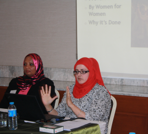 Susan Al Shahri and Habiba Al Hinai explaining Oman